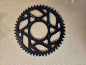 rozeta Ultra Bee 54z  černá dural Sur-Ron